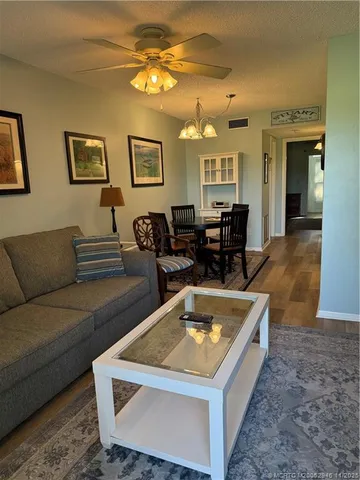 a view of a livingroom with furniture and wooden floor