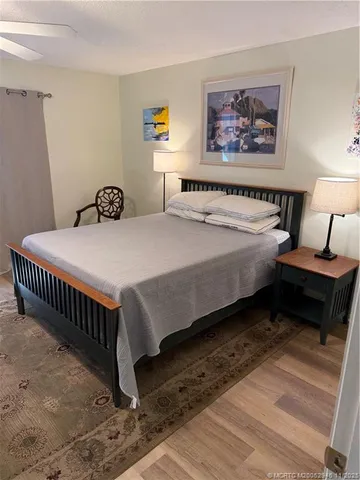 a bedroom with bed and a window