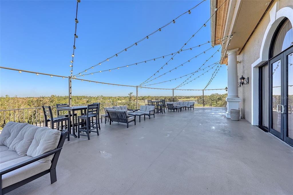 7717 US Open Loop Lakewood Ranch, FL 34202 - Photo 77 of 95 a view of a chairs and table in the patio