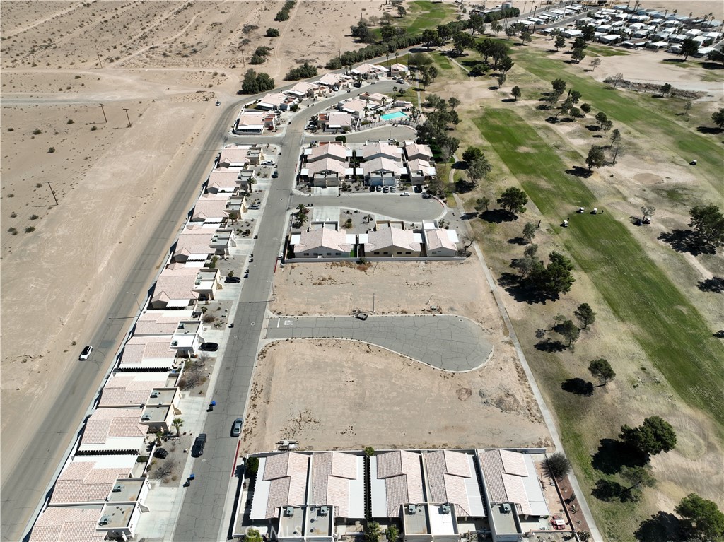 3935 Par Court Blythe, CA 92225 - Photo 6 of 11 an aerial view of multi story residential apartment building with yard