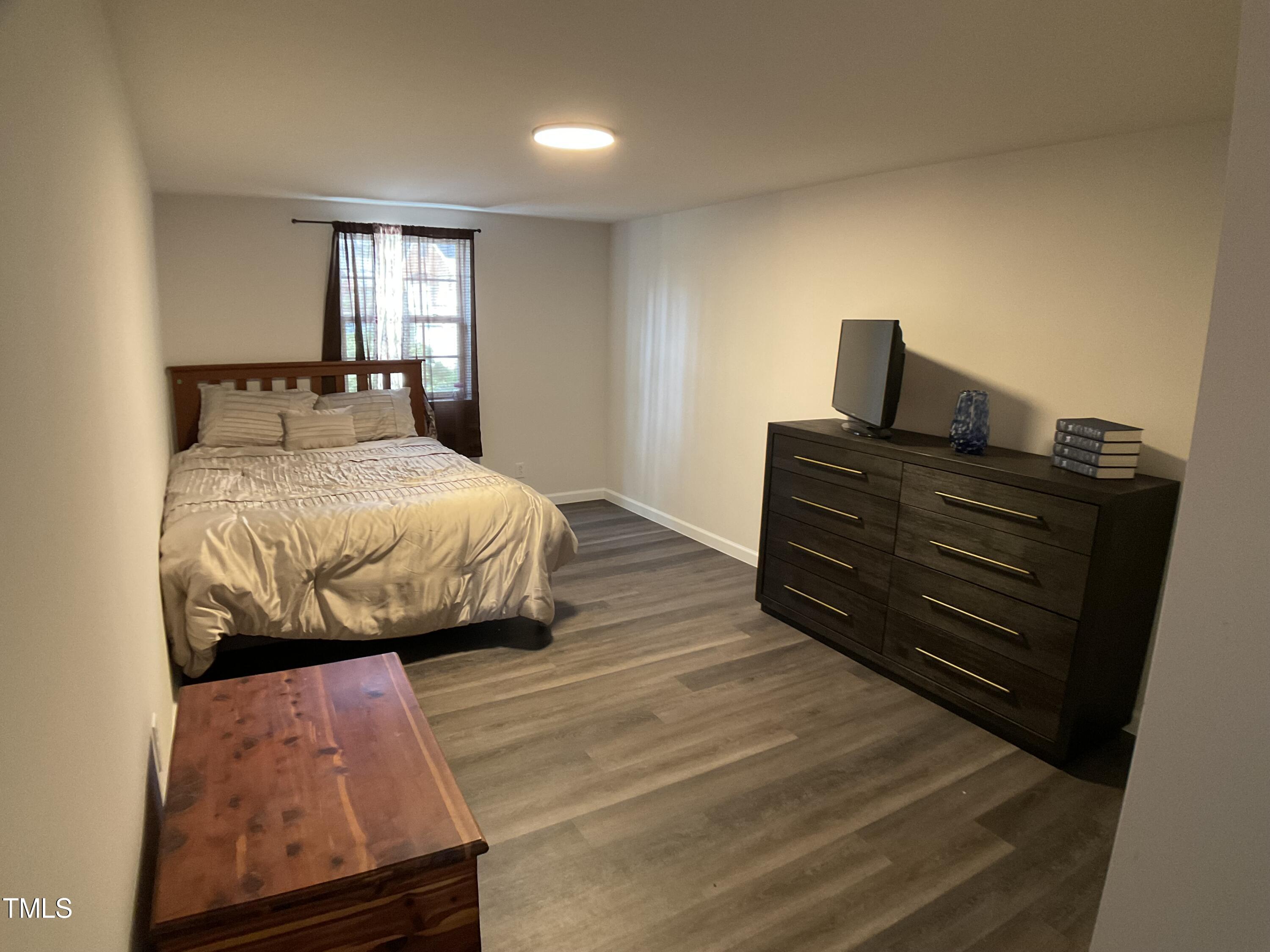 134 Allensville Road Roxboro, NC 27573 - Photo 18 of 33 a bedroom with a bed and window