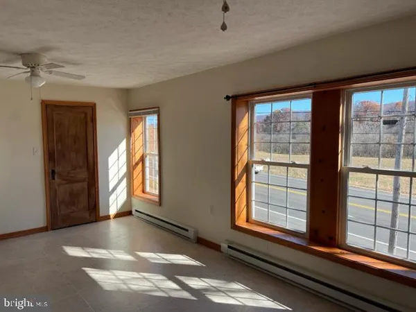 a view of a room that has a window in it