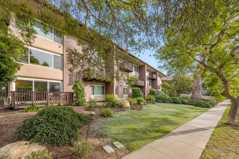 a view of house with yard