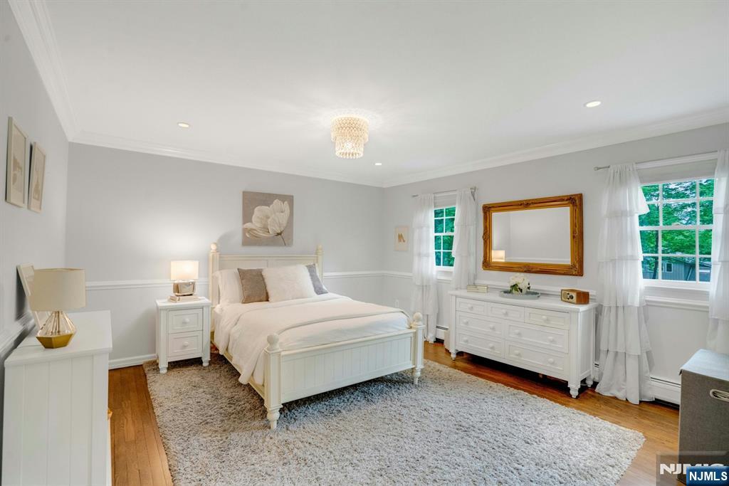 48 Hopper Farm Road Upper Saddle River, NJ 07458 - Photo 18 of 43 a spacious bedroom with a bed and a window