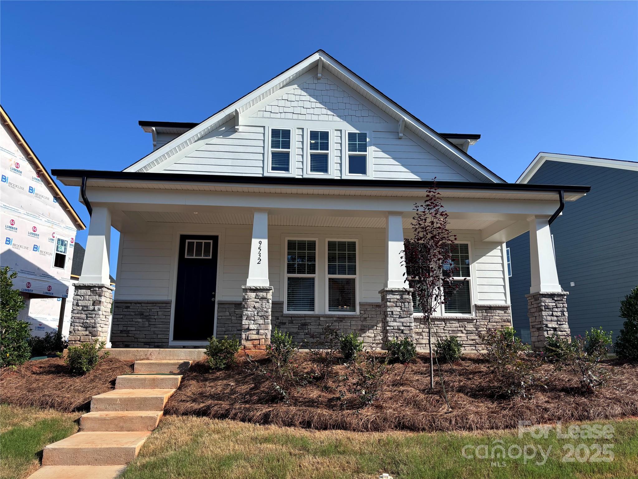 a front view of a house with a porch