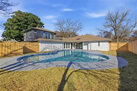 a view of a house with a swimming pool