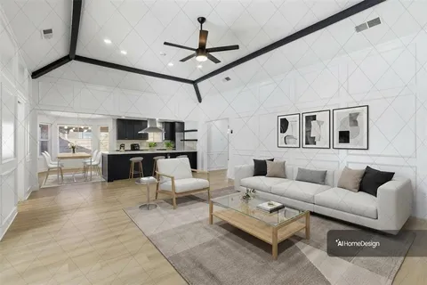 a living room with furniture kitchen view and a chandelier