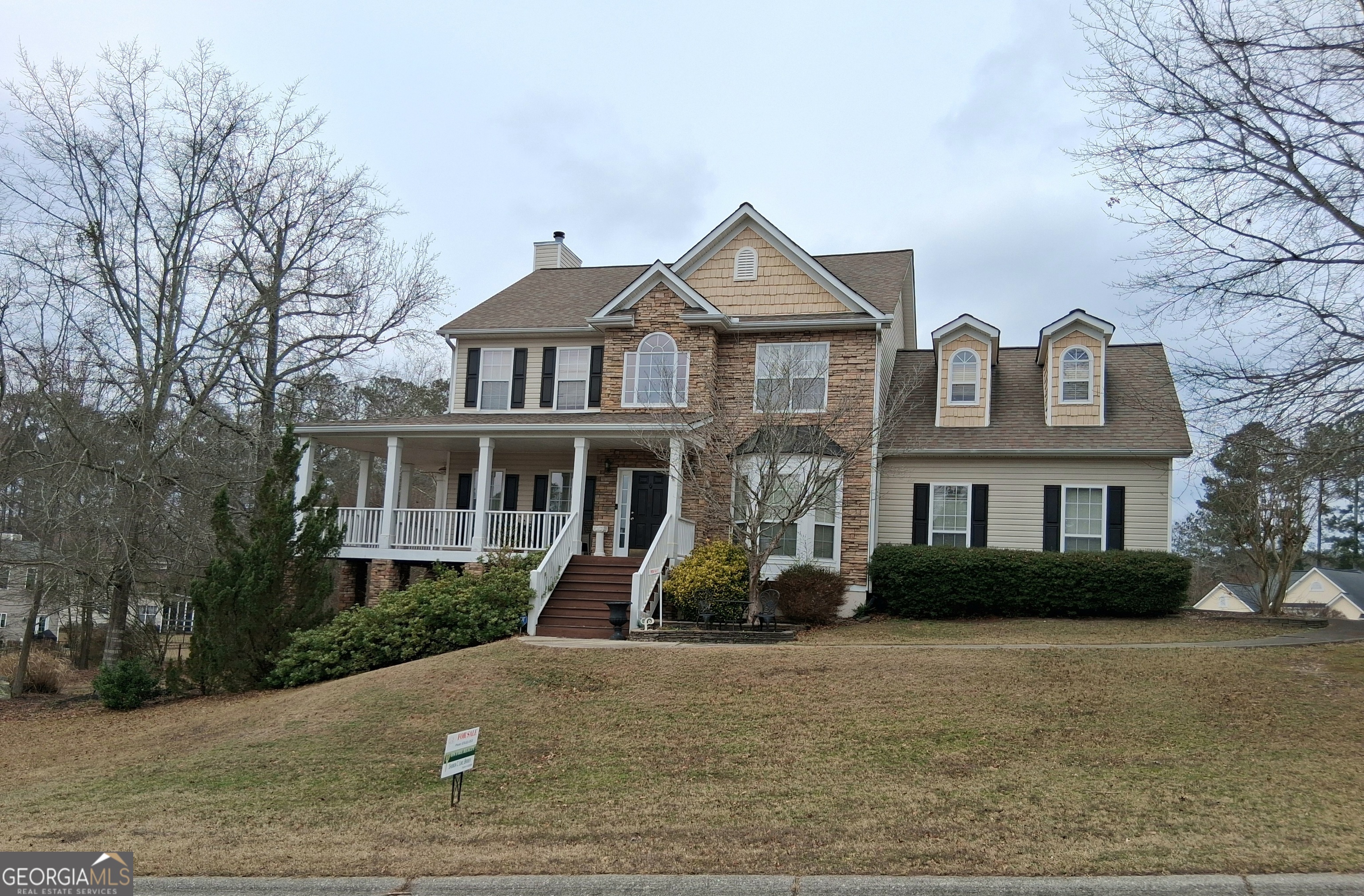 2141 Raccoon Court Villa Rica, GA 30180 - Photo 2 of 2 a front view of a house with garden