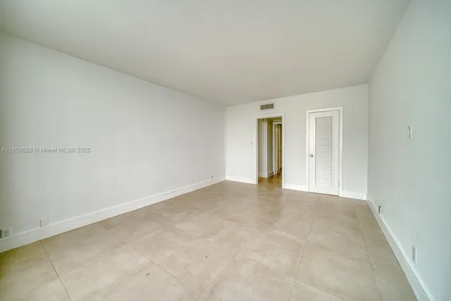 a view of an empty room and window