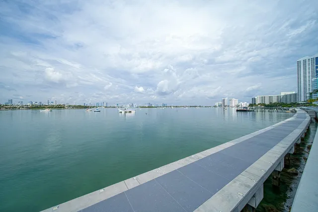 a view of a lake with a city from a balcony