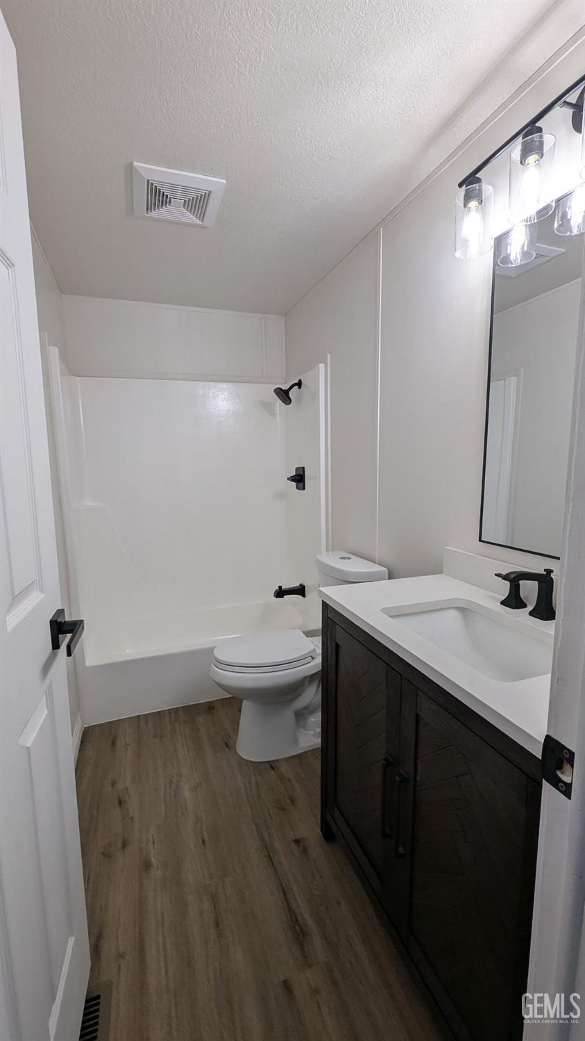 Undisclosed Address Wasco, CA 93280 - Photo 5 of 14 a bathroom with a sink a toilet and a mirror