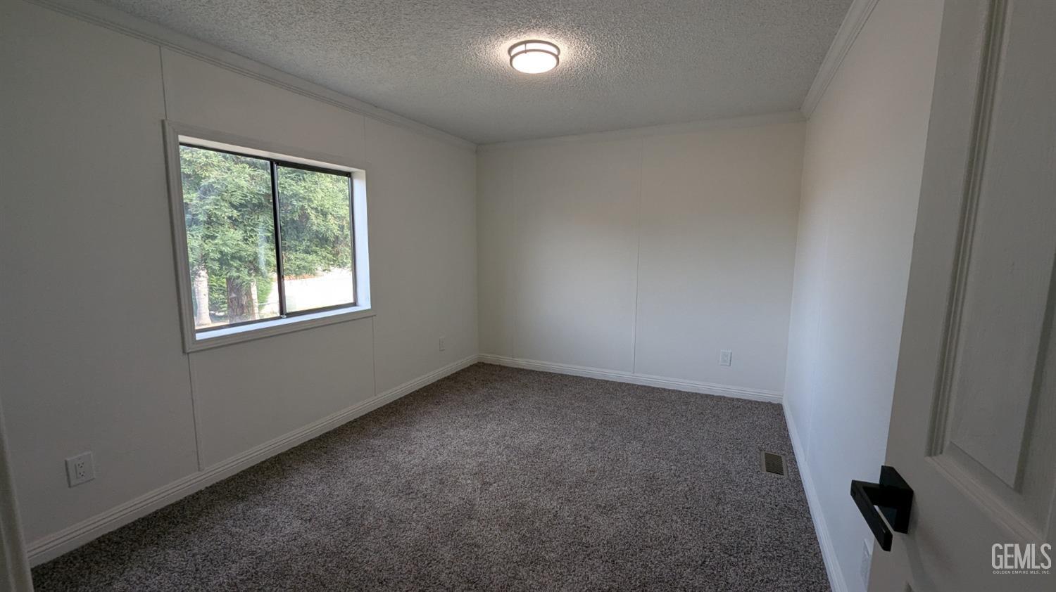Undisclosed Address Wasco, CA 93280 - Photo 8 of 14 an empty room with a window