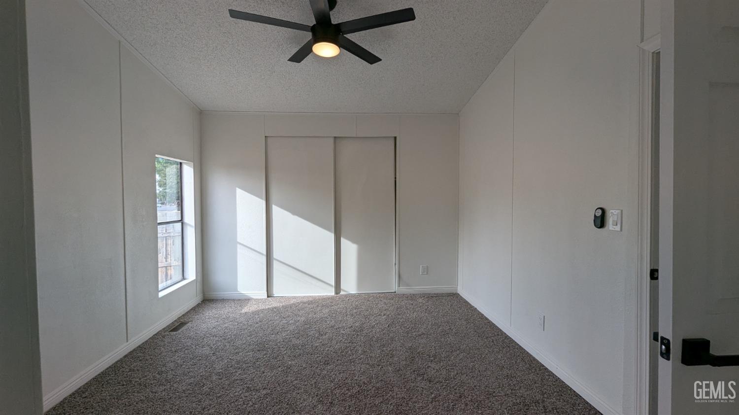 Undisclosed Address Wasco, CA 93280 - Photo 10 of 14 a view of empty room with ceiling fan