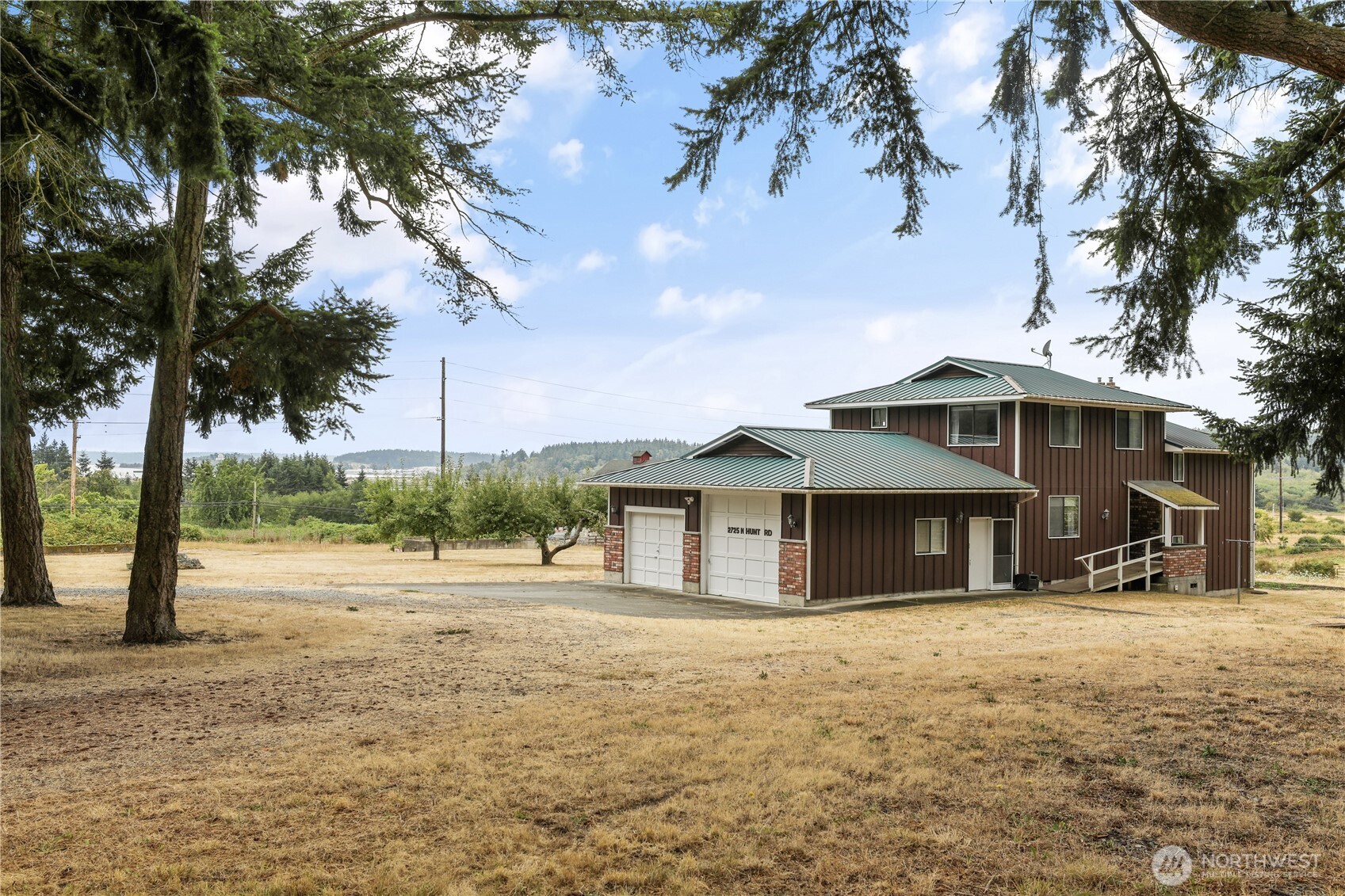 2725 Hunt Road Oak Harbor, WA 98277 - Photo 1 of 40 a front view of a house with a garden