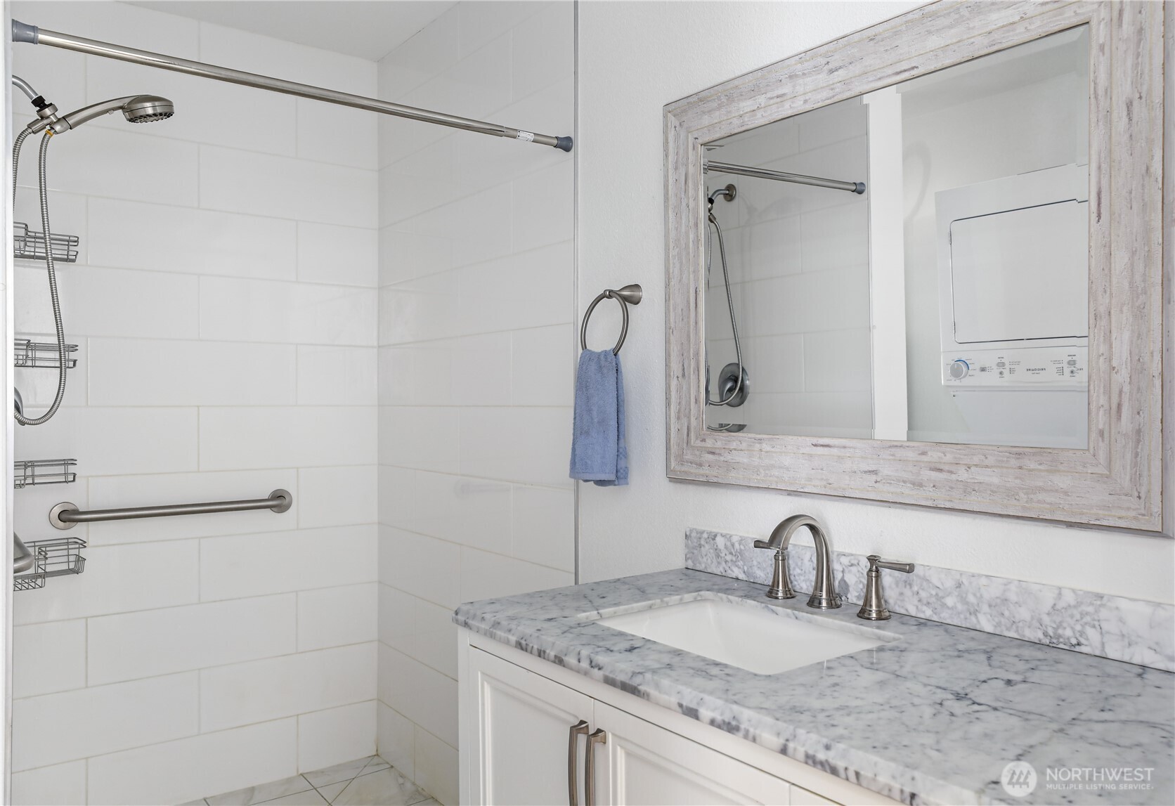 2725 Hunt Road Oak Harbor, WA 98277 - Photo 13 of 40 a bathroom with a granite countertop sink a mirror and shower