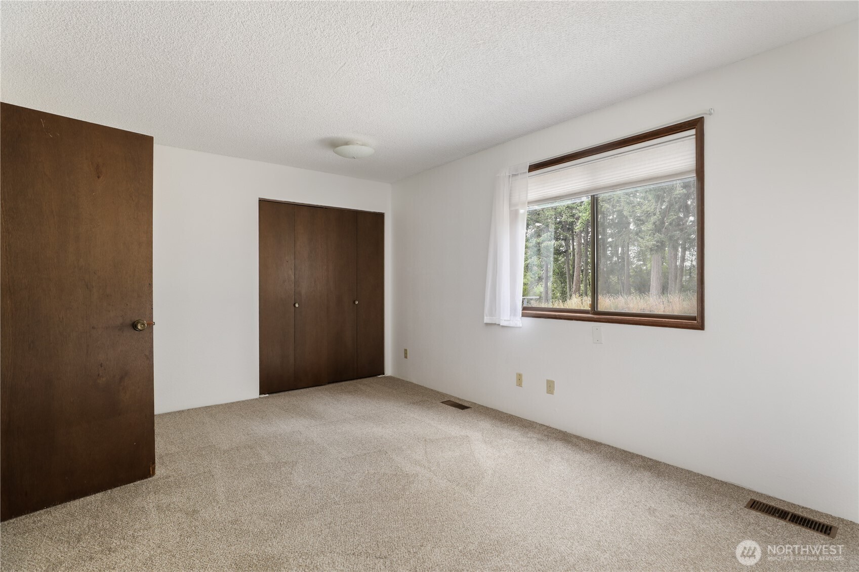 2725 Hunt Road Oak Harbor, WA 98277 - Photo 14 of 40 a view of an empty room with window