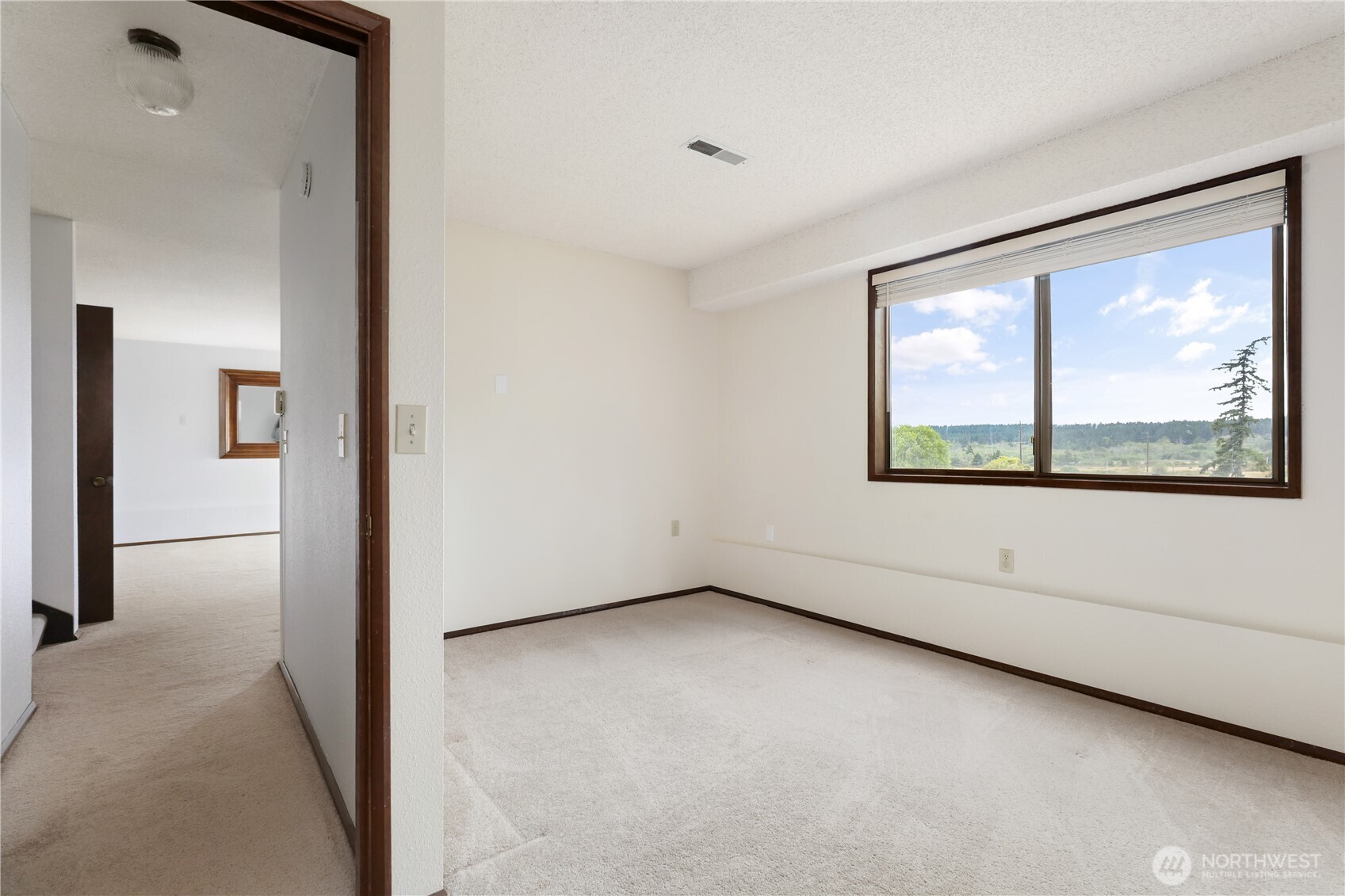 2725 Hunt Road Oak Harbor, WA 98277 - Photo 23 of 40 an empty room with windows and closet