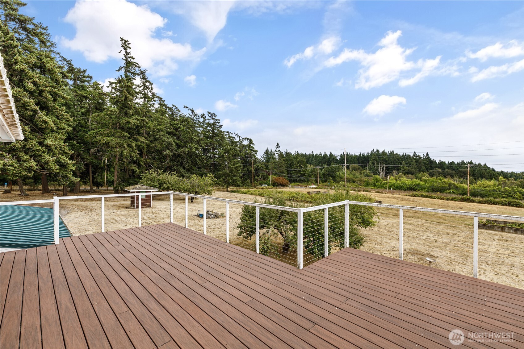 2725 Hunt Road Oak Harbor, WA 98277 - Photo 29 of 40 a view of a balcony with wooden floor and lake view