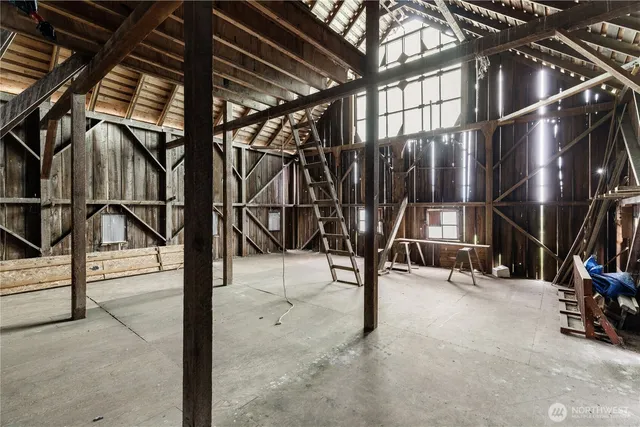 a wooden house with large trees