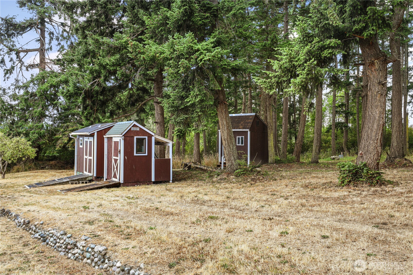 2725 Hunt Road Oak Harbor, WA 98277 - Photo 35 of 40 a wooden house with large trees