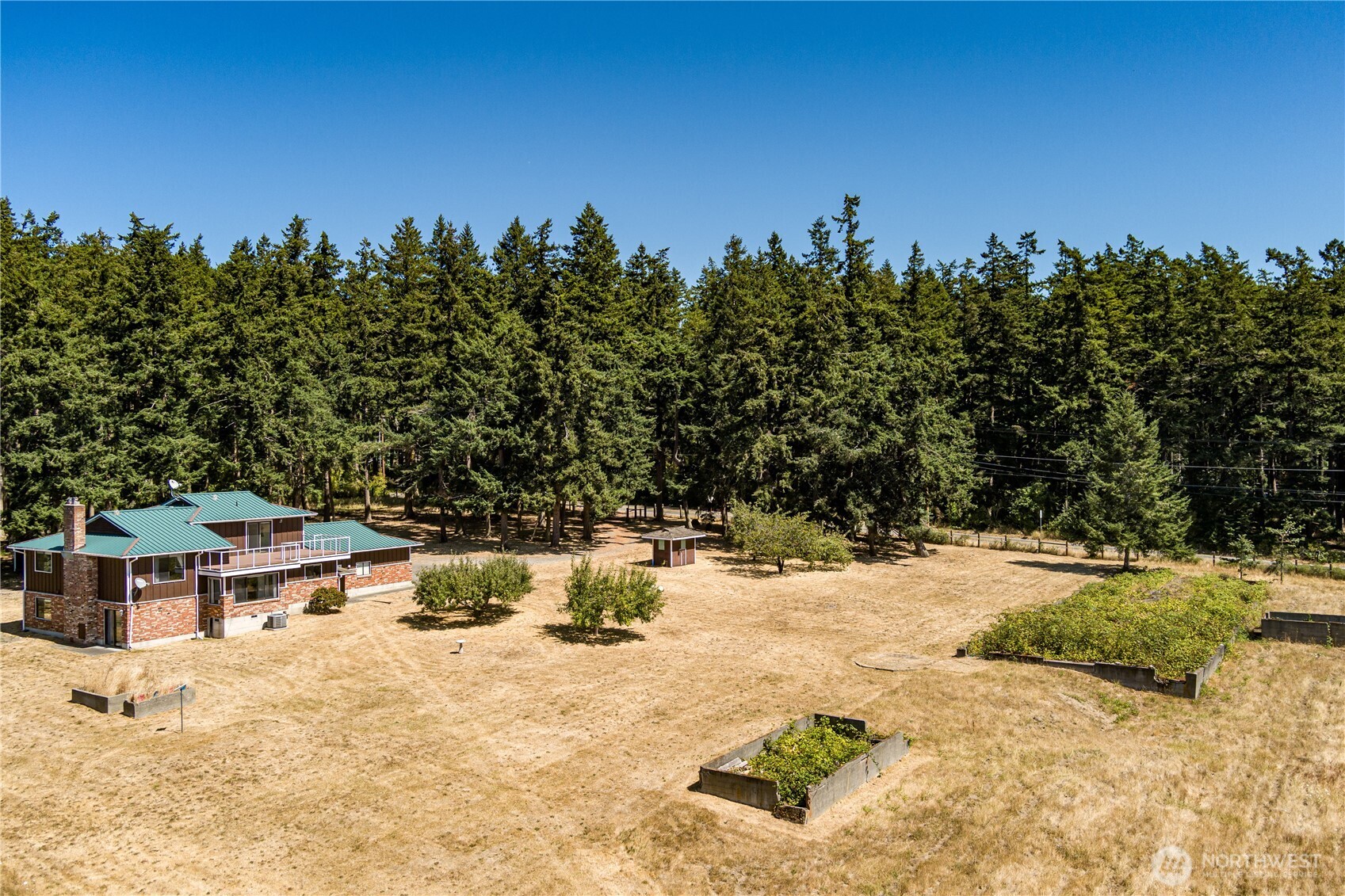 2725 Hunt Road Oak Harbor, WA 98277 - Photo 39 of 40 a view of a swimming pool with an outdoor space and seating area