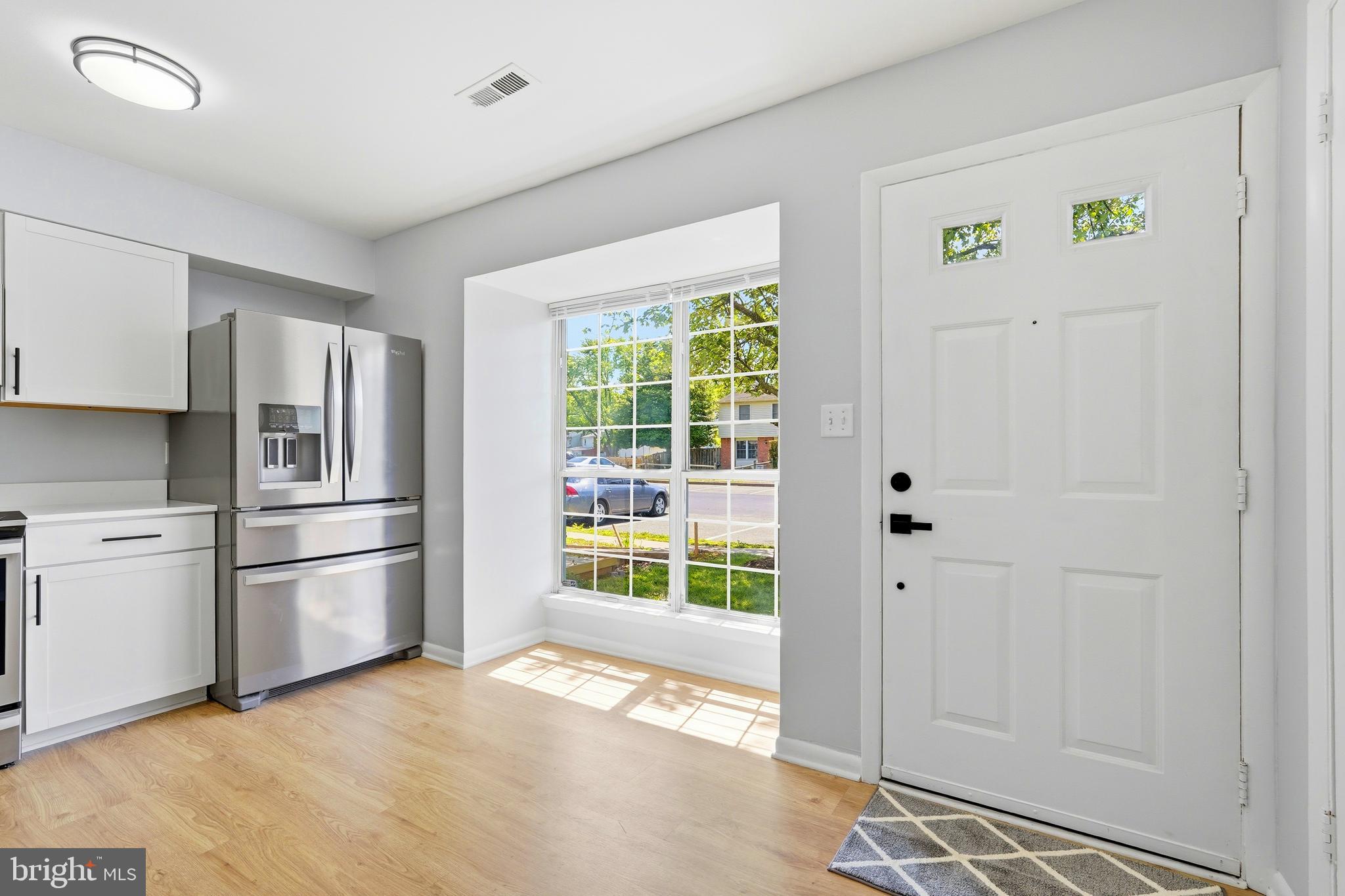 3682 Masthead Trail Triangle, VA 22172 - Photo 9 of 53 a kitchen with a refrigerator and countertop