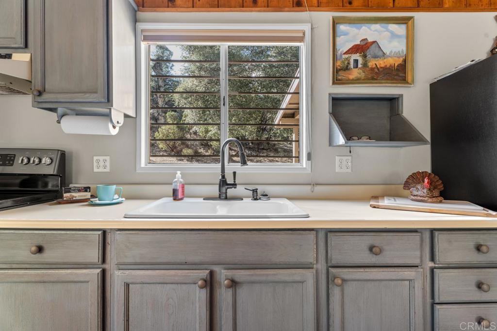 9150- Pine Creek Road, Unit 8 Pine Valley, CA 91962 - Photo 12 of 23 a bathroom with a sink and a mirror