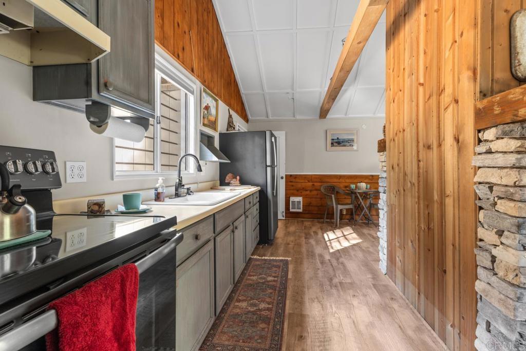 9150- Pine Creek Road, Unit 8 Pine Valley, CA 91962 - Photo 15 of 23 a kitchen with stainless steel appliances a sink and a refrigerator