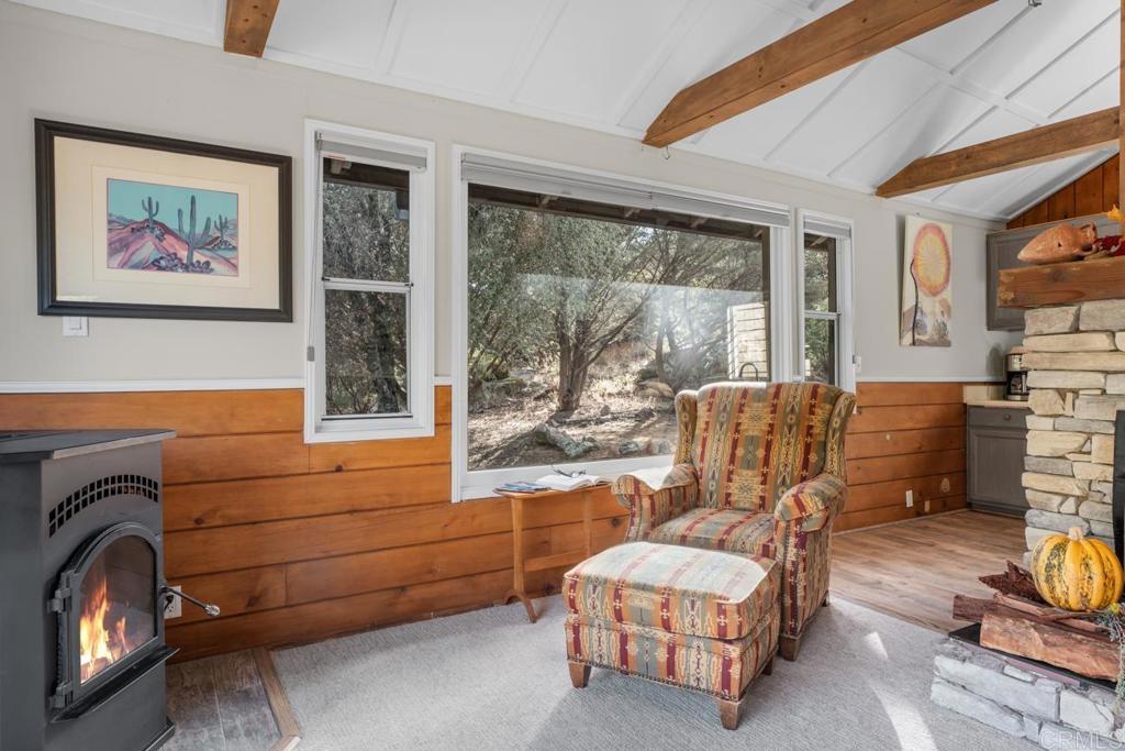 9150- Pine Creek Road, Unit 8 Pine Valley, CA 91962 - Photo 18 of 23 a living room with furniture and a floor to ceiling window