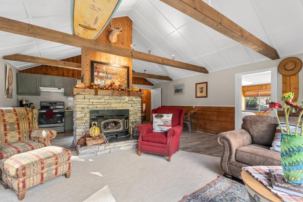 9150- Pine Creek Road, Unit 8 Pine Valley, CA 91962 - Photo 19 of 23 a living room with furniture and a fireplace