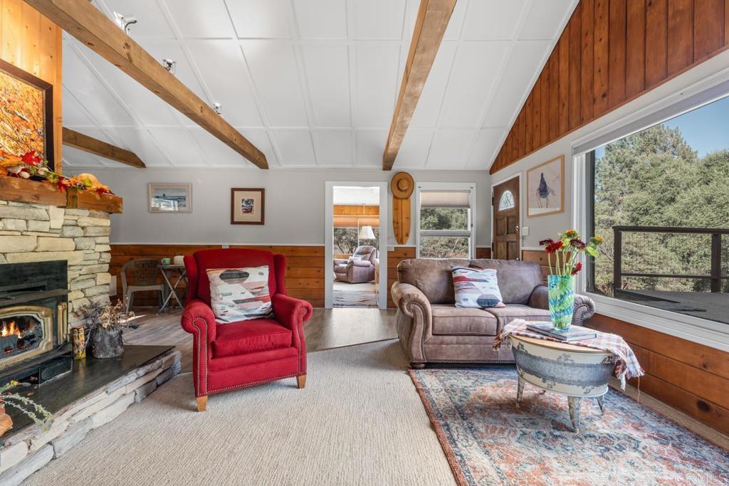 9150- Pine Creek Road, Unit 8 Pine Valley, CA 91962 - Photo 20 of 23 a living room with furniture fireplace and a large window