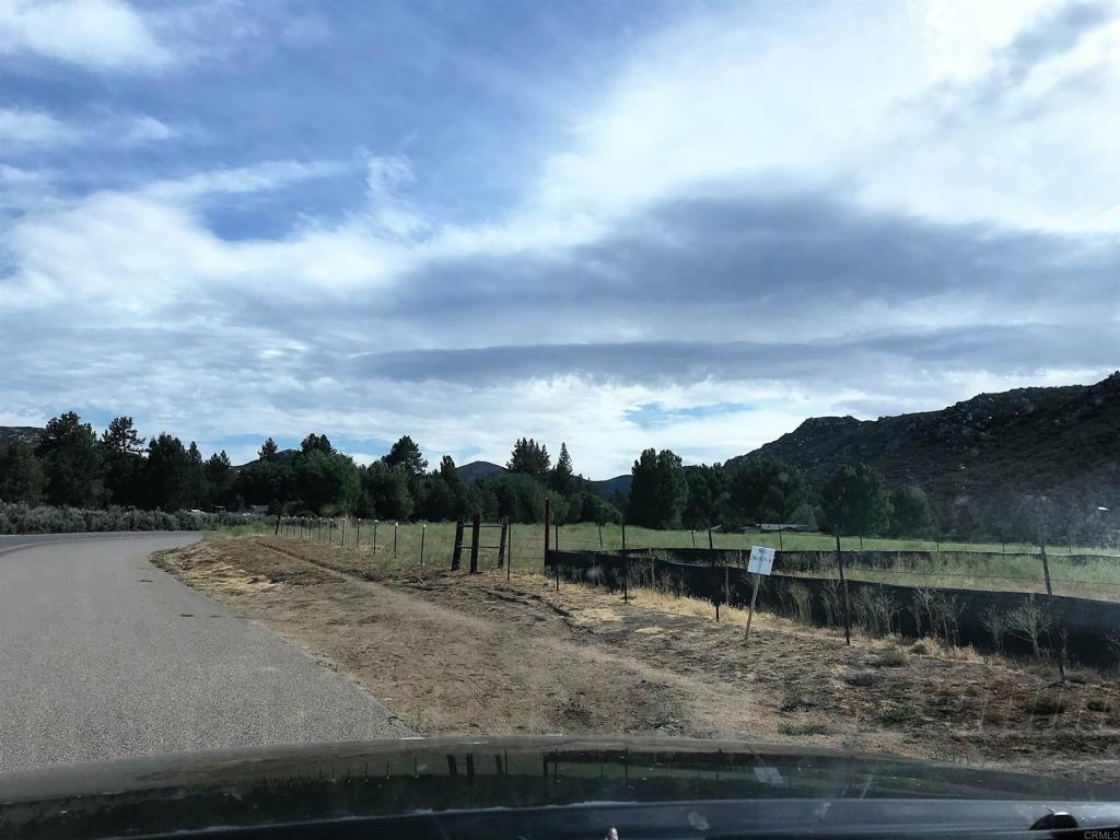 9150- Pine Creek Road, Unit 8 Pine Valley, CA 91962 - Photo 2 of 23 a view of a lake with mountains in the background