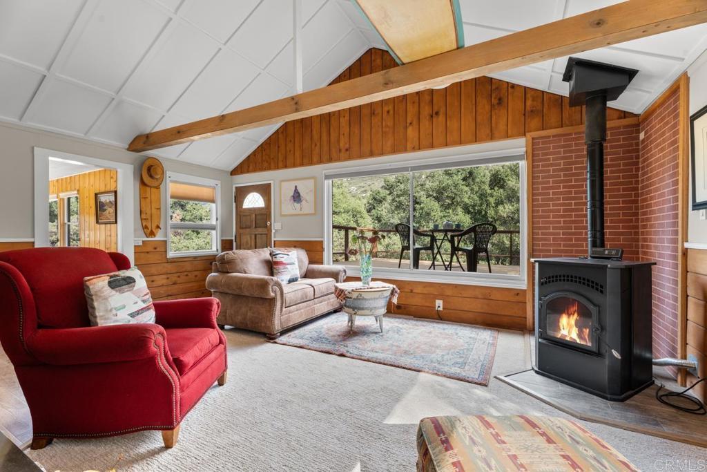 9150- Pine Creek Road, Unit 8 Pine Valley, CA 91962 - Photo 21 of 23 a living room with furniture and a fireplace
