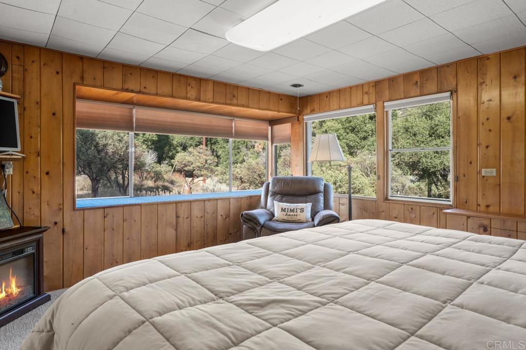 9150- Pine Creek Road, Unit 8 Pine Valley, CA 91962 - Photo 5 of 23 a large bed sitting in a bedroom next to a window