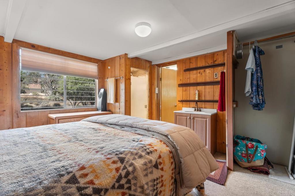 9150- Pine Creek Road, Unit 8 Pine Valley, CA 91962 - Photo 9 of 23 a bedroom with a bed and a large window with outer view