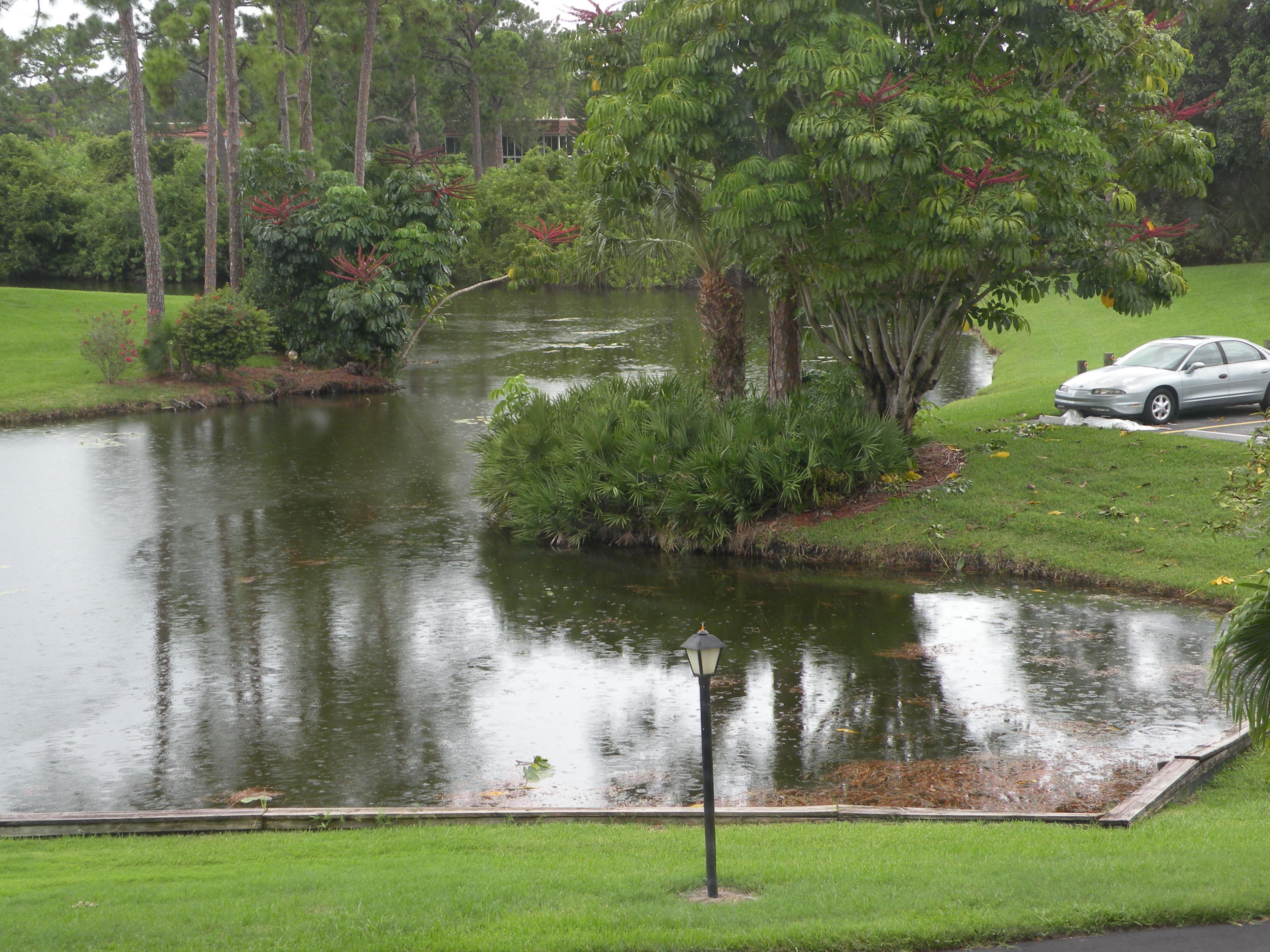 1225 Northwest 21st Street, Unit 211 Stuart, FL 34994 - Photo 1 of 14 GLASSED PORCH VIEW