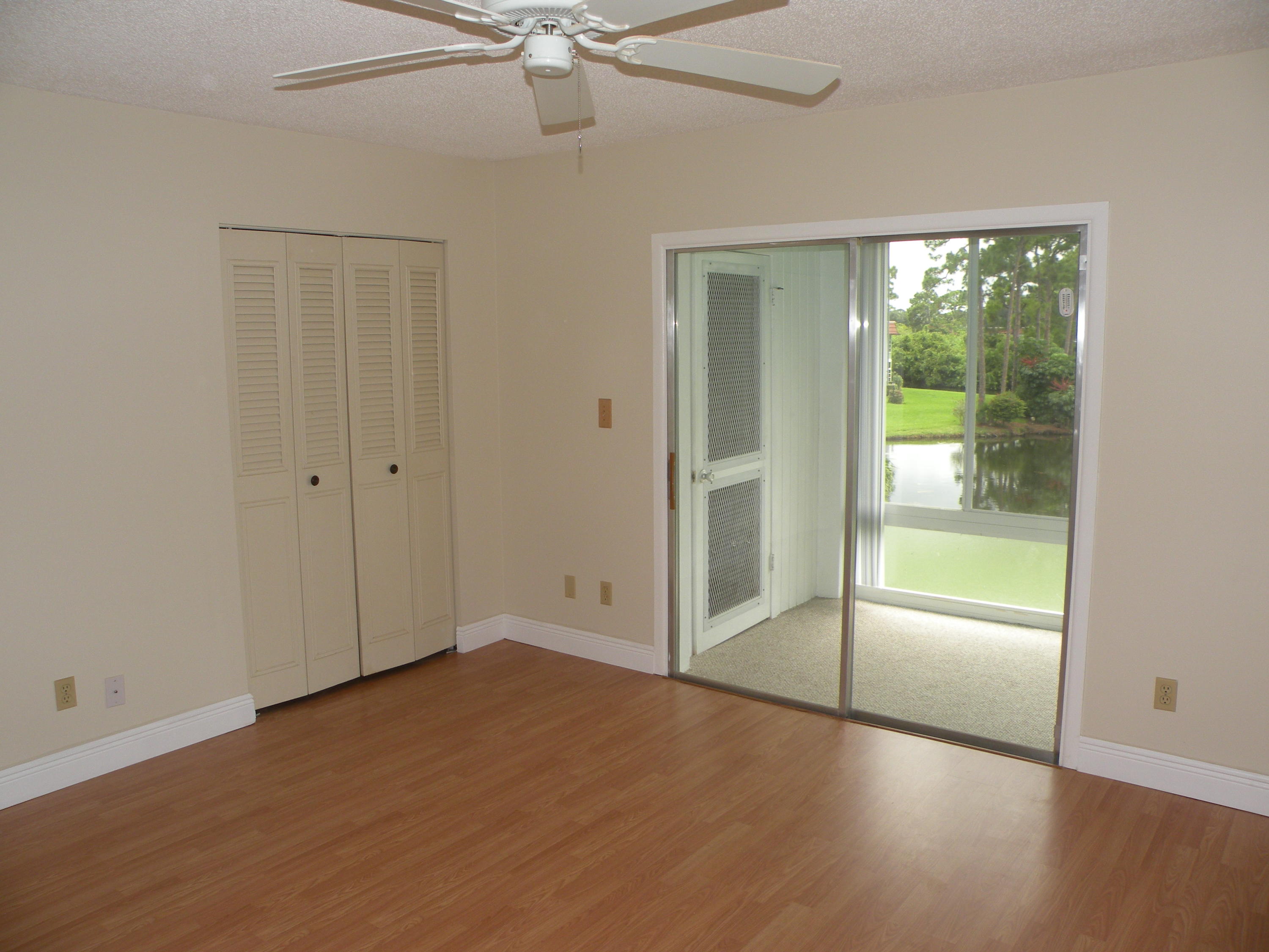 1225 Northwest 21st Street, Unit 211 Stuart, FL 34994 - Photo 6 of 14 MASTER BEDROOM