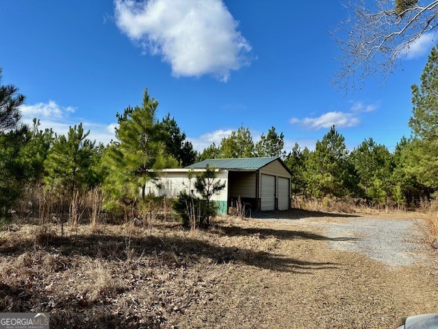 1800 Rock Springs Road Dublin, GA 31021 - Photo 5 of 9 a front view of a house with a yard