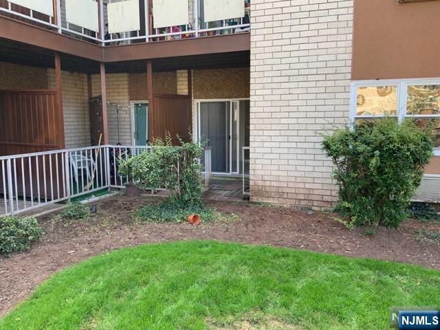1111 River Road, Unit F2 Edgewater, NJ 07020 - Photo 16 of 21 a view of a house with a yard and plants