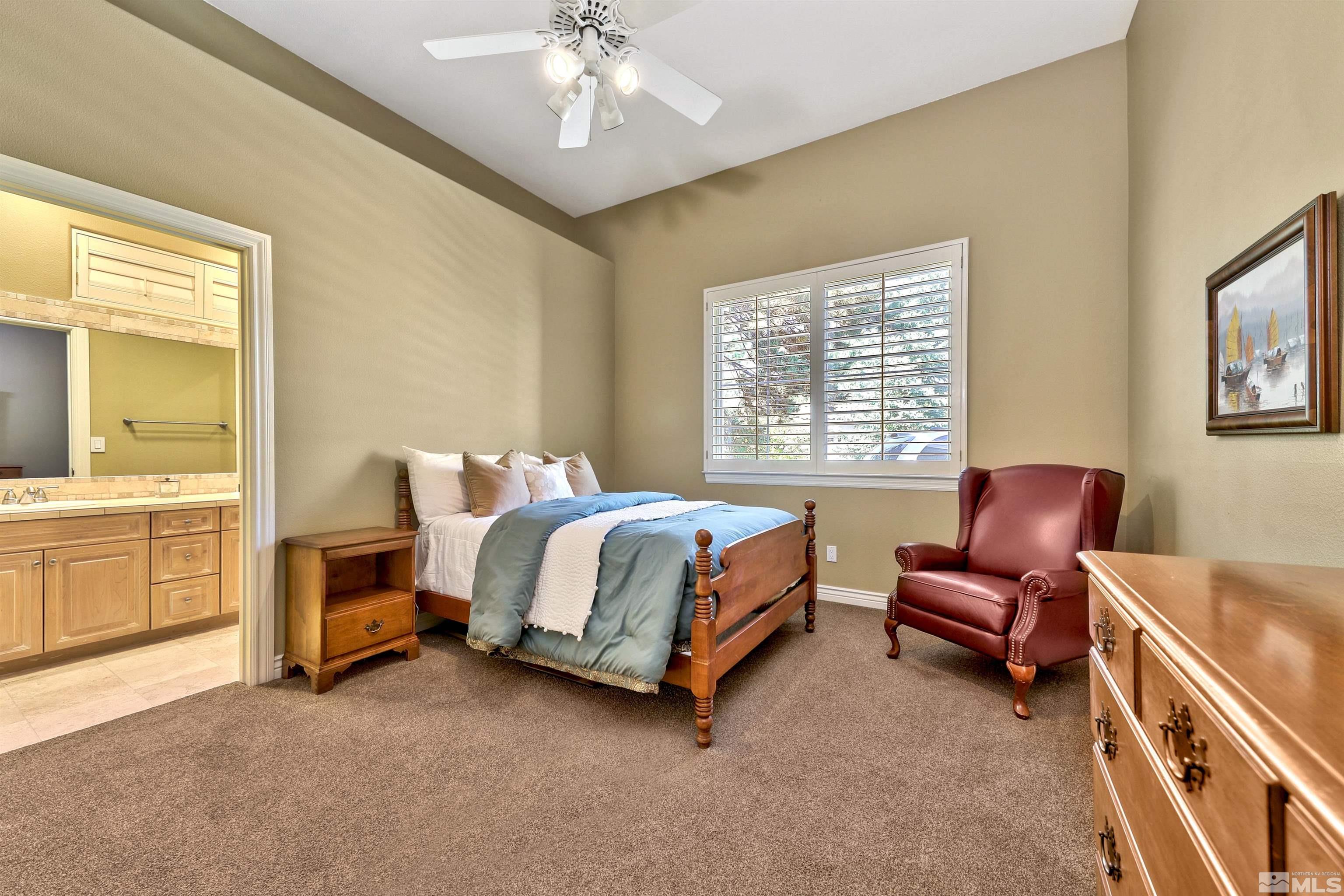 701 Aspen Trail Reno, NV 89519 - Photo 33 of 40 a bed room with a bed and a chair