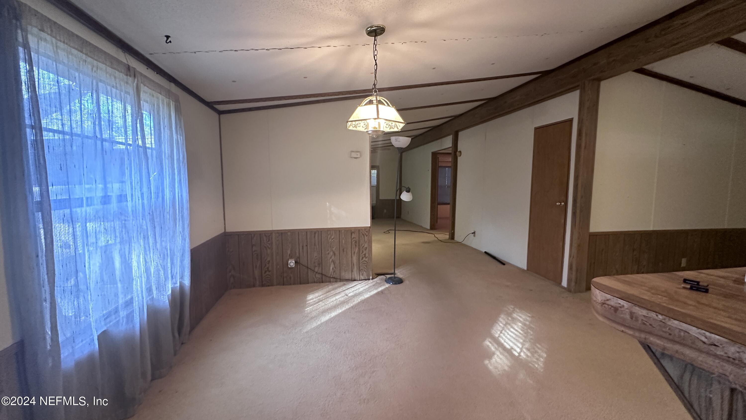 5002 Herton Road Jacksonville, FL 32258 - Photo 12 of 21 a view of a livingroom with a ceiling fan