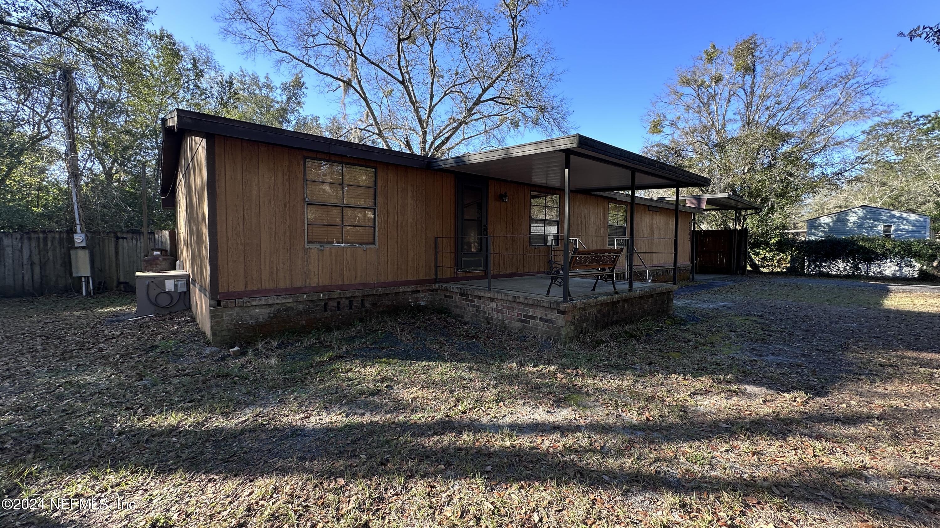 5002 Herton Road Jacksonville, FL 32258 - Photo 2 of 21 a front view of a house with a yard