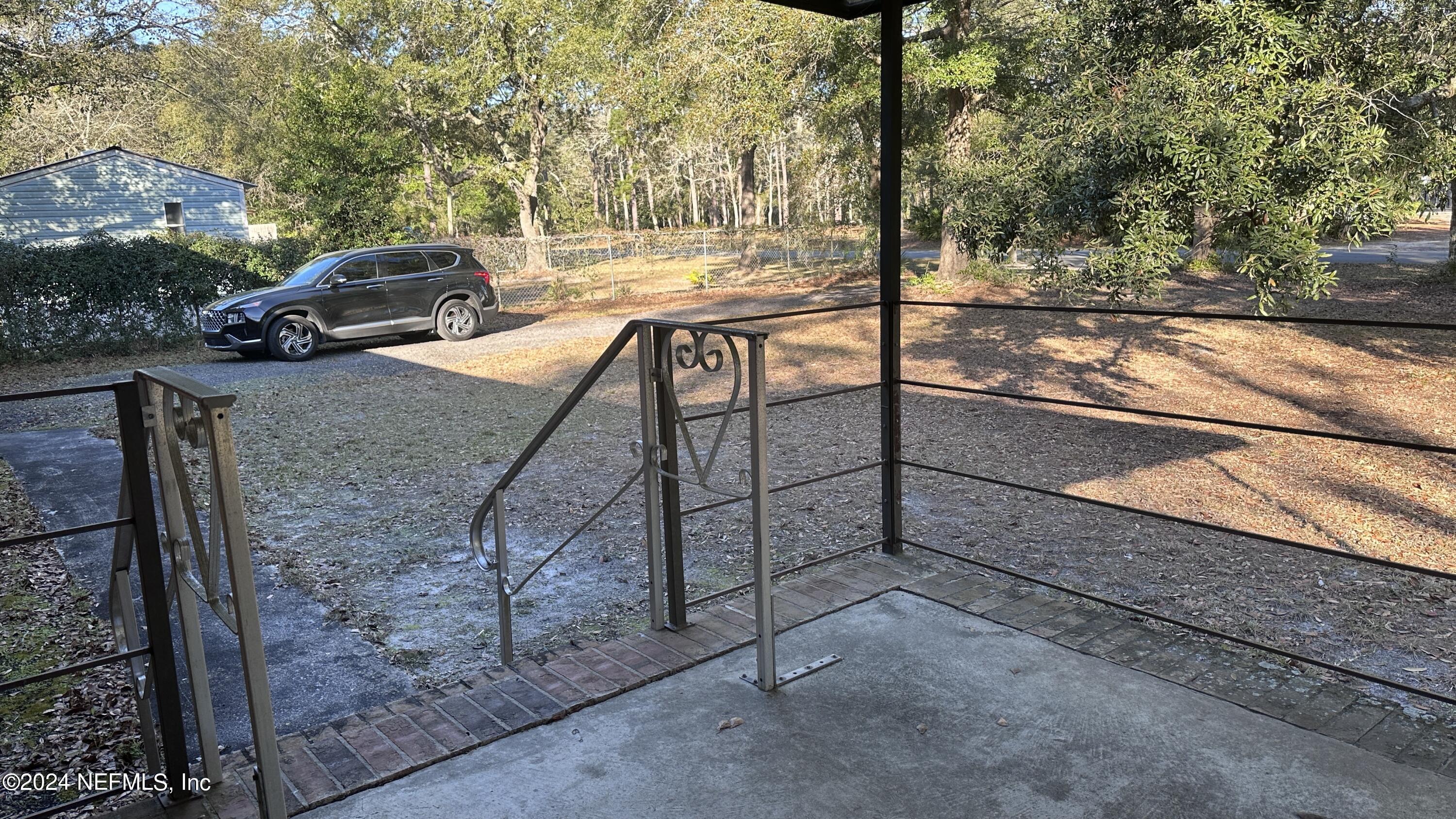 5002 Herton Road Jacksonville, FL 32258 - Photo 4 of 21 a view of a terrace with yard