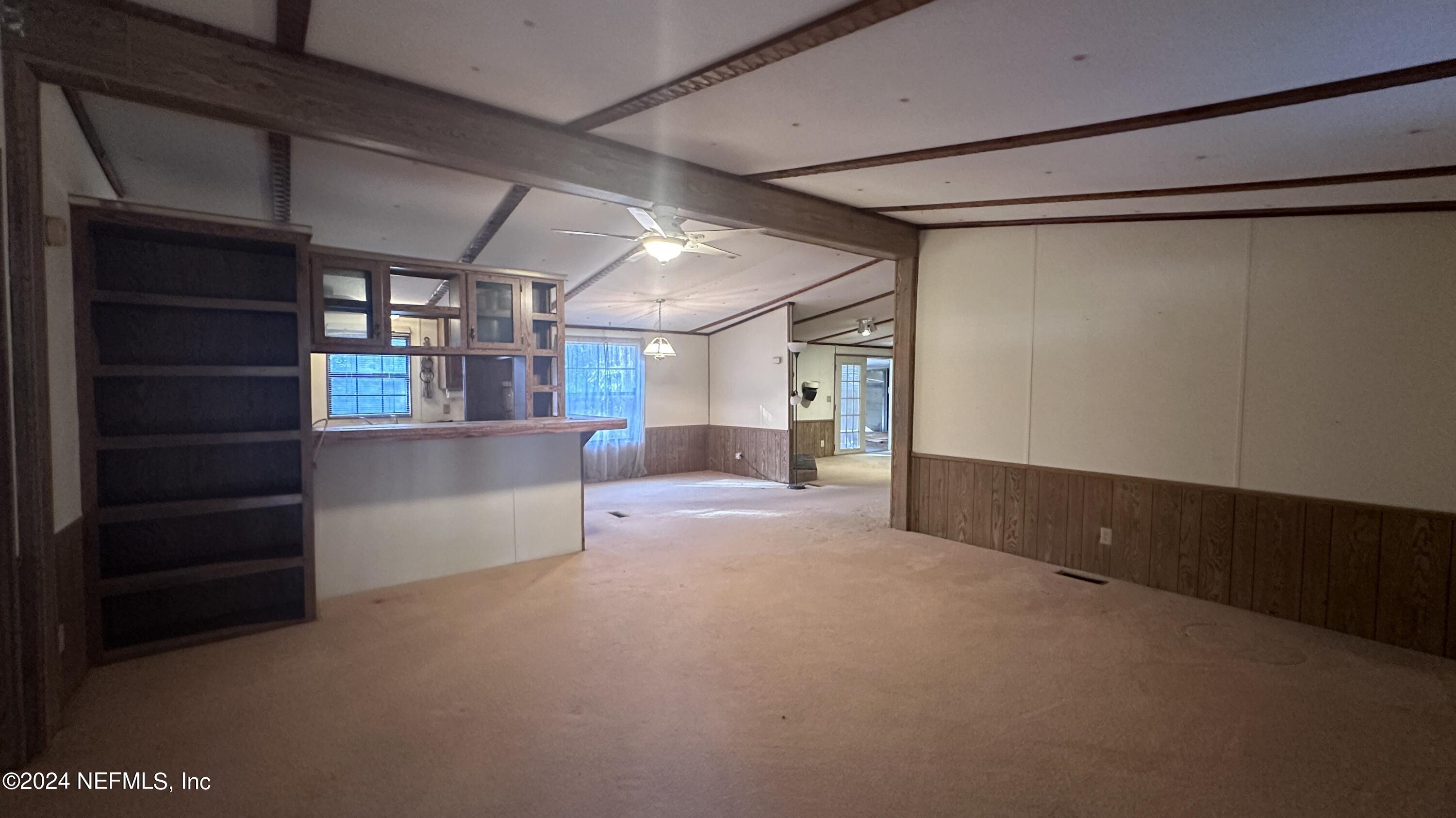 5002 Herton Road Jacksonville, FL 32258 - Photo 5 of 21 a view of an empty room with a cabinet