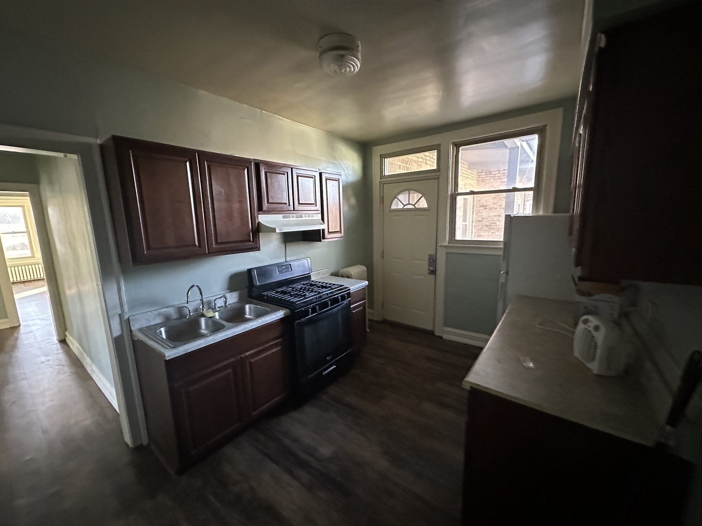 12602 Artesian Avenue Blue Island, IL 60406 - Photo 6 of 12 a kitchen with granite countertop stove top oven and cabinets