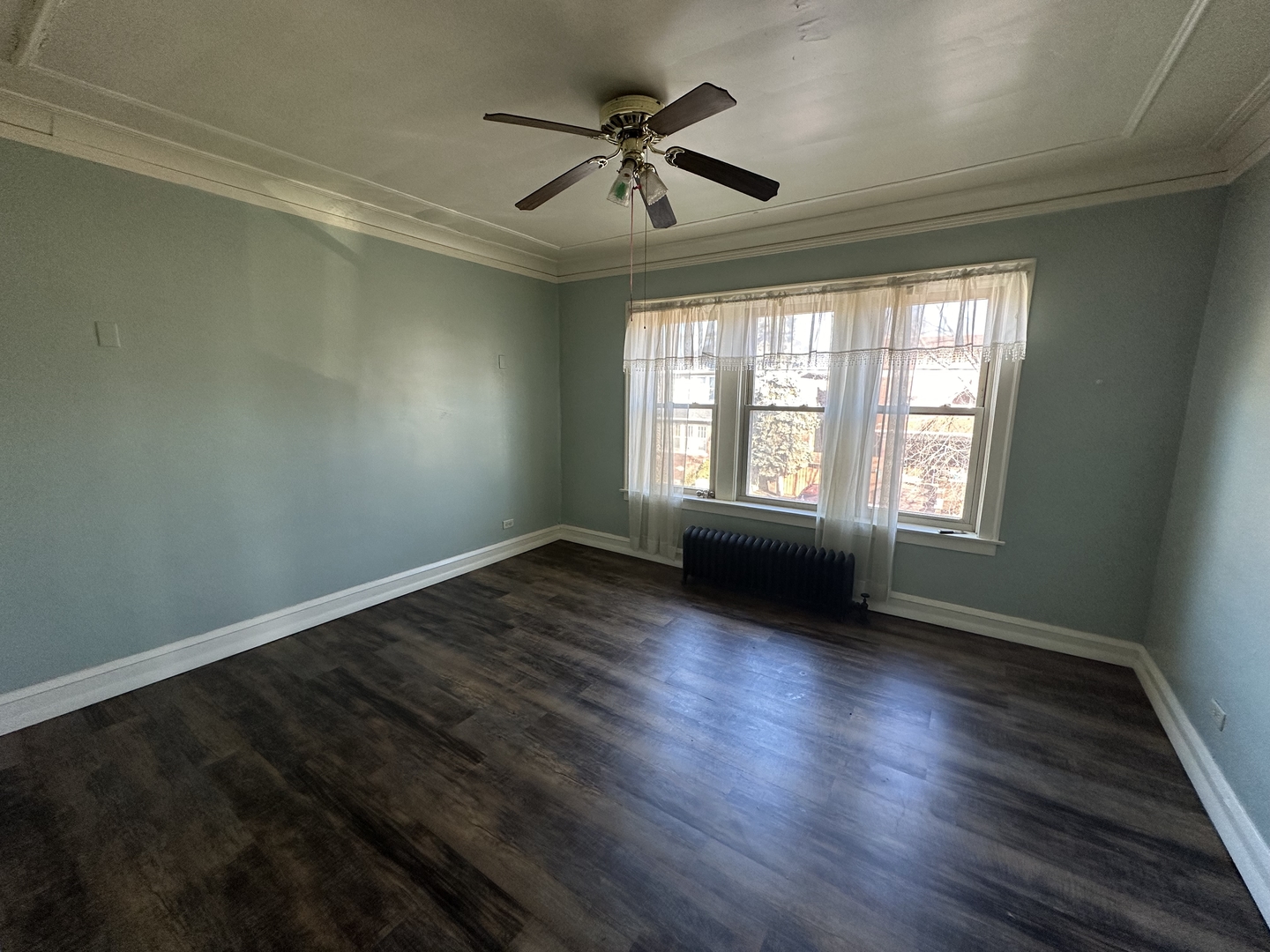 12602 Artesian Avenue Blue Island, IL 60406 - Photo 7 of 12 wooden floor in an empty room with a window