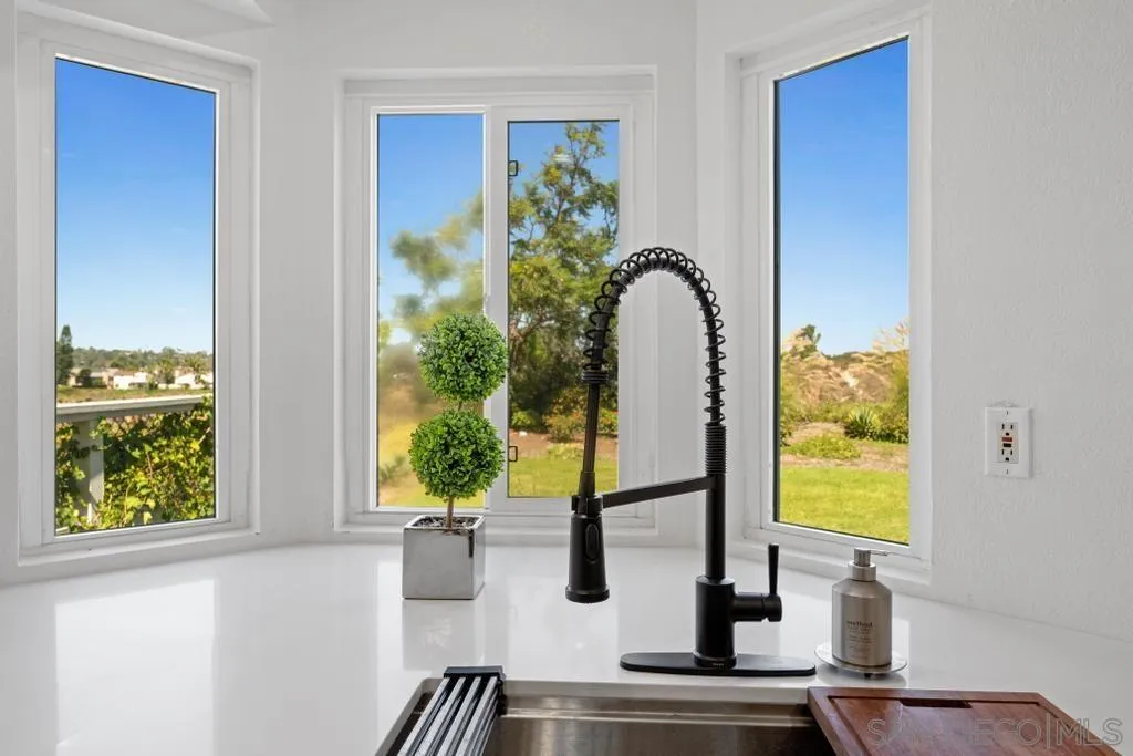 3638 Lorimer Lane Encinitas, CA 92024 - Photo 19 of 72 a bathroom with a sink and a mirror