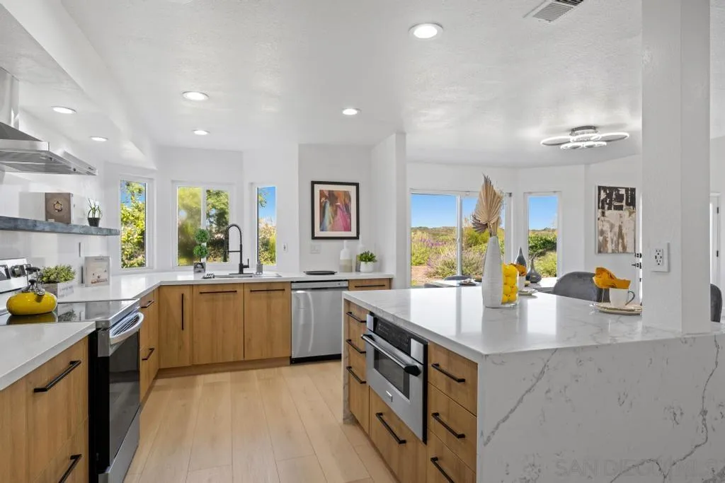 3638 Lorimer Lane Encinitas, CA 92024 - Photo 21 of 72 a large kitchen with stainless steel appliances lots of counter top space