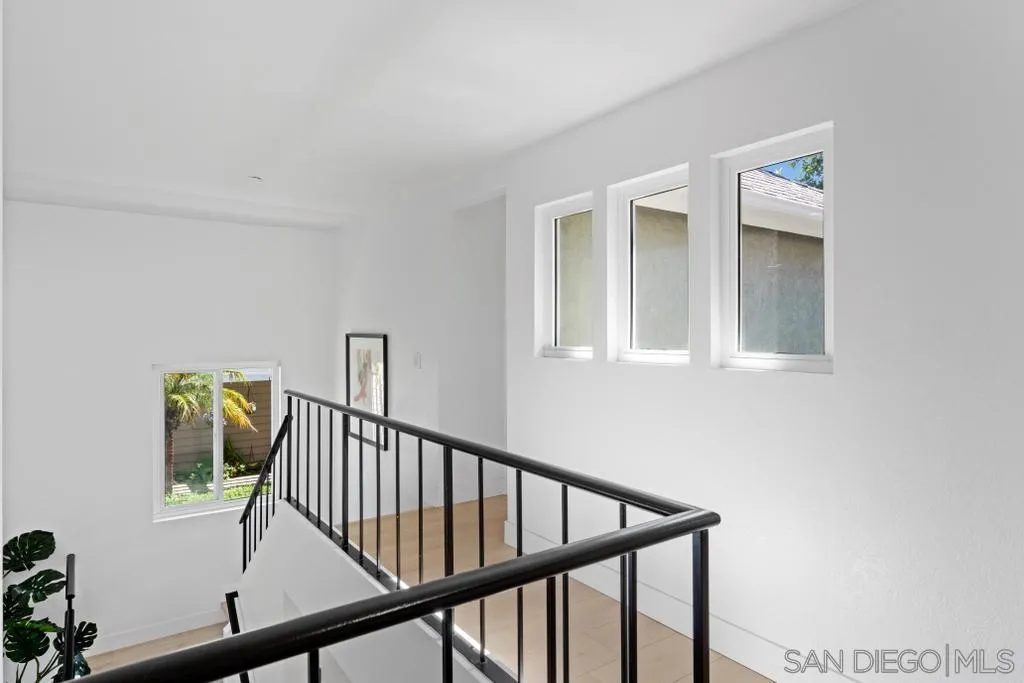 3638 Lorimer Lane Encinitas, CA 92024 - Photo 29 of 72 a view of staircase with railing and white walls