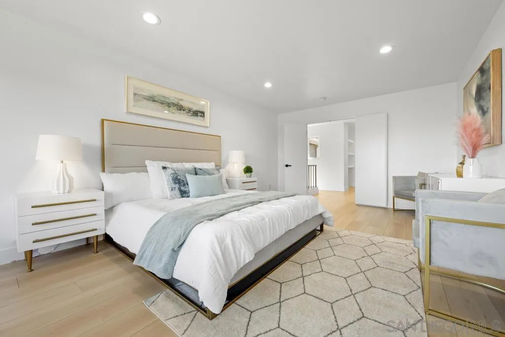 3638 Lorimer Lane Encinitas, CA 92024 - Photo 41 of 72 a bedroom with a bed and a walk in closet